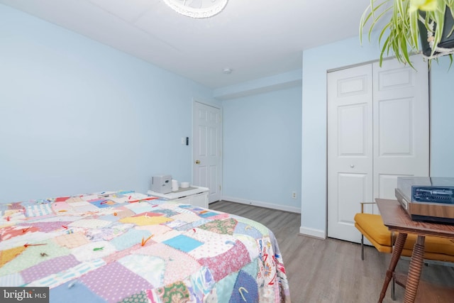 2302 Searles Rd, Dundalk, MD 21222 - bedroom with light wood-style flooring and a closet