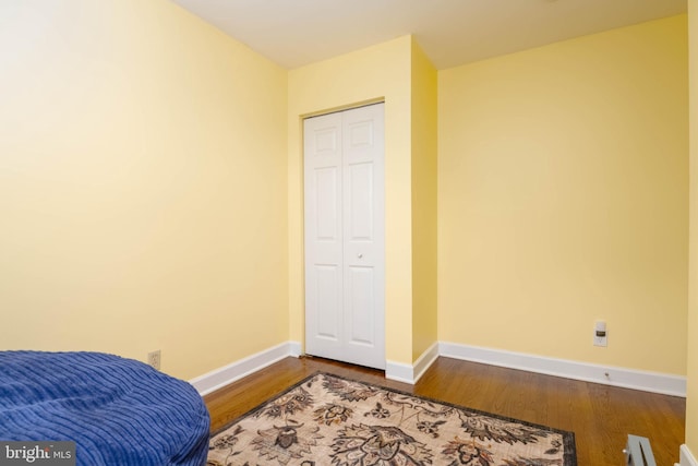 2302 Searles Rd, Dundalk, MD 21222 - bedroom with dark wood-style floors and a closet