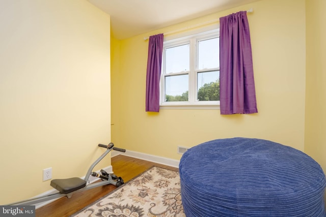 2302 Searles Rd, Dundalk, MD 21222 - workout room featuring baseboards and wood finished floors