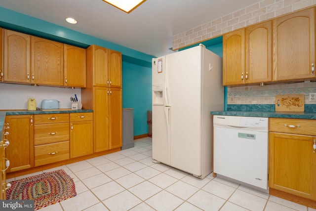 2302 Searles Rd, Dundalk, MD 21222 - kitchen featuring white appliances, decorative backsplash, dark countertops, light tile patterned flooring, and recessed lighting