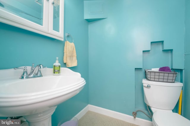 2302 Searles Rd, Dundalk, MD 21222 - bathroom featuring toilet and tile patterned floors