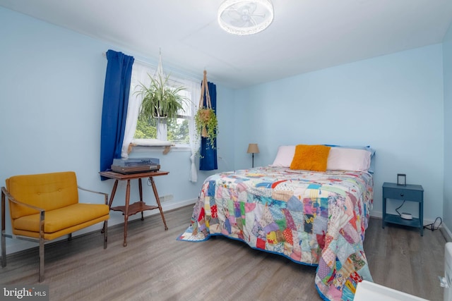 2302 Searles Rd, Dundalk, MD 21222 - bedroom with wood finished floors and baseboards