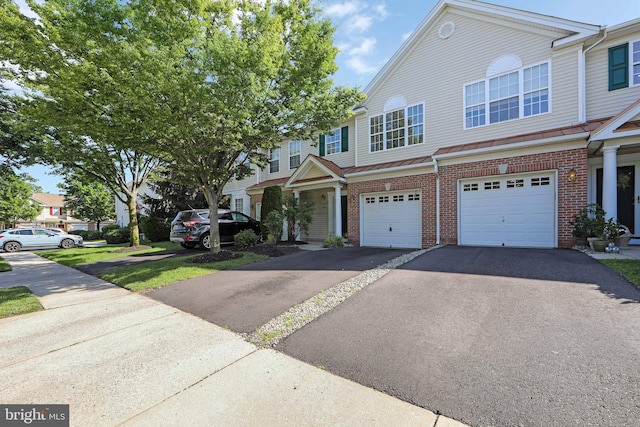 304 Amy Way, Cinnaminson, NJ 08077 - view of property with brick siding, driveway, and an attached garage