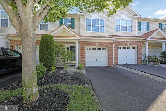 304 Amy Way, Cinnaminson, NJ 08077 - townhome / multi-family property featuring brick siding, an attached garage, and driveway