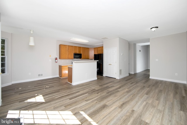 304 Amy Way, Cinnaminson, NJ 08077 - unfurnished living room with baseboards and wood finished floors