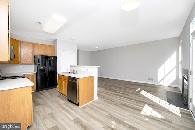 304 Amy Way, Cinnaminson, NJ 08077 - kitchen with black appliances, light countertops, light wood finished floors, open floor plan, and a kitchen island with sink