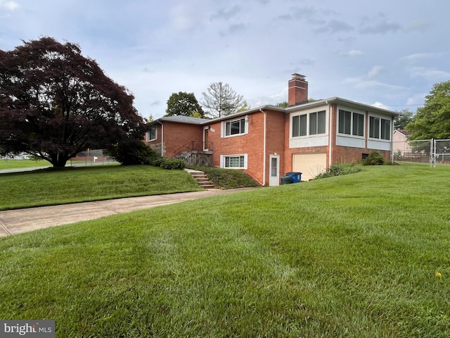 12829 Baker Dr, Silver Spring, MD 20904 - view of side of home with an attached garage, a chimney, and brick siding