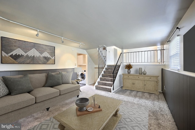 4604 View Dr, Spring Grove, PA 17362 - living room featuring washer / clothes dryer, rail lighting, light carpet, and stairs