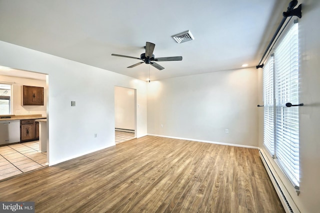 4604 View Dr, Spring Grove, PA 17362 - unfurnished room featuring light wood-type flooring, a baseboard heating unit, ceiling fan, and a baseboard radiator
