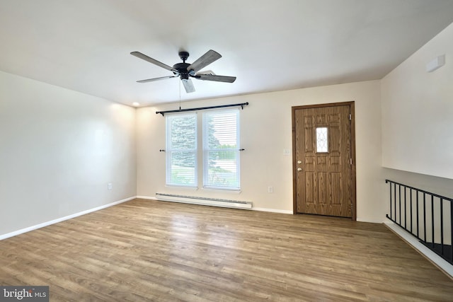 4604 View Dr, Spring Grove, PA 17362 - foyer featuring baseboard heating, wood finished floors, and a ceiling fan