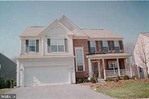 12602 Withan Dr, Silver Spring, MD 20904 - view of front of property with a porch, an attached garage, driveway, and a balcony