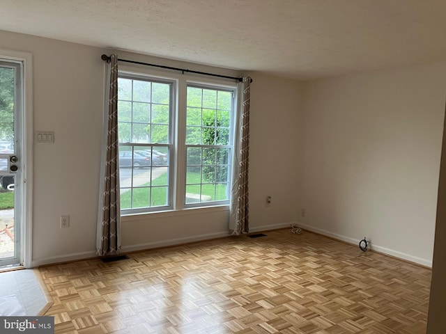 18327 Ivy Oak Ter, Gaithersburg, MD 20877 - unfurnished room featuring plenty of natural light and a textured ceiling