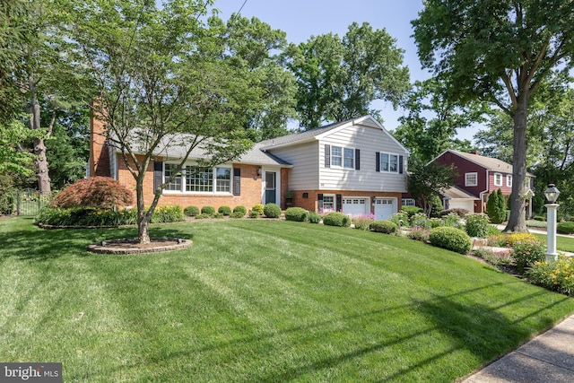 295 Crescent Ave, Moorestown, NJ 08057 - tri-level home with an attached garage, a front lawn, brick siding, and driveway
