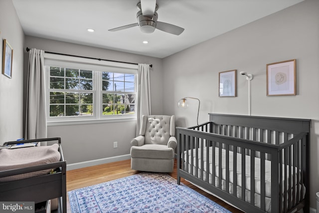 295 Crescent Ave, Moorestown, NJ 08057 - bedroom featuring wood finished floors, recessed lighting, a ceiling fan, and a crib