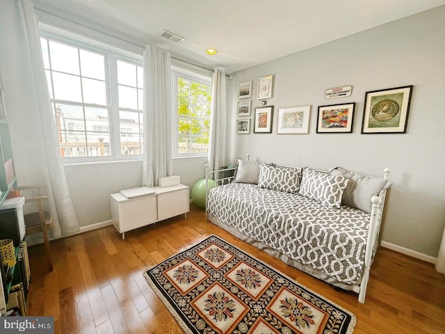 445 Manor Pl NW Unit 3, Washington, DC 20010 - bedroom with wood-type flooring and baseboards