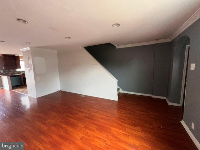 7638 Thouron Ave, Philadelphia, PA 19150 - unfurnished living room with ornamental molding, arched walkways, wood finished floors, and recessed lighting