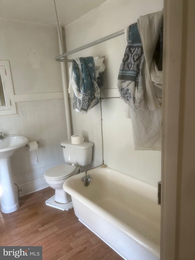 19 E Main St, Richland, PA 17087 - full bathroom featuring a bath, wood finished floors, and wainscoting