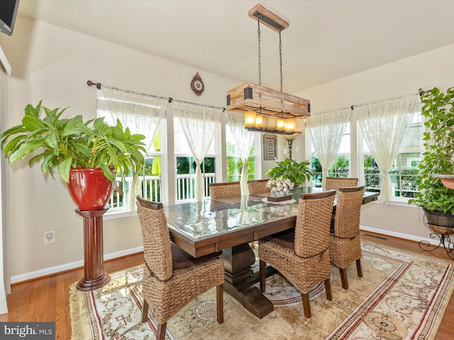 9175 Bealls Farm Rd, Frederick, MD 21704 - dining room featuring wood finished floors, plenty of natural light, and a chandelier