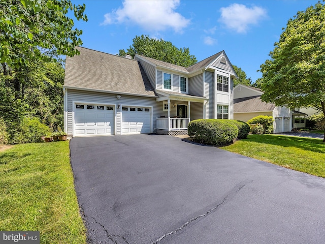 23732 Rolling Fork Way, Gaithersburg, MD 20882 - view of front of house with a garage, driveway, a front lawn, a porch, and roof with shingles
