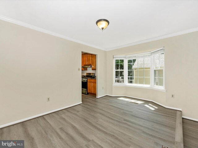 23732 Rolling Fork Way, Gaithersburg, MD 20882 - unfurnished living room featuring crown molding and wood finished floors