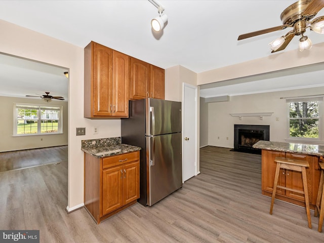 23732 Rolling Fork Way, Gaithersburg, MD 20882 - kitchen with freestanding refrigerator, open floor plan, ceiling fan, and light wood-style floors