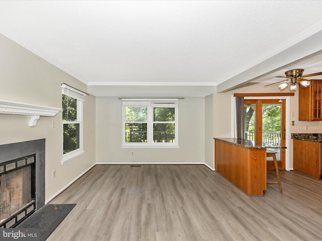 23732 Rolling Fork Way, Gaithersburg, MD 20882 - unfurnished living room with wood finished floors, ornamental molding, a fireplace with flush hearth, and a ceiling fan