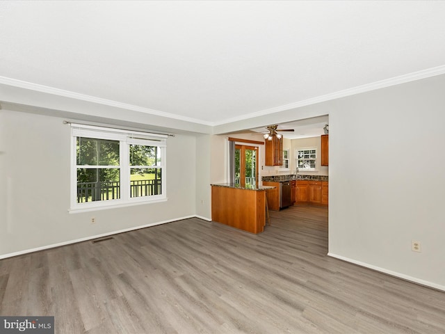 23732 Rolling Fork Way, Gaithersburg, MD 20882 - unfurnished living room with dark wood-style floors, crown molding, and a ceiling fan