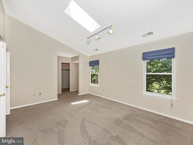 23732 Rolling Fork Way, Gaithersburg, MD 20882 - carpeted spare room with a skylight, lofted ceiling, and track lighting