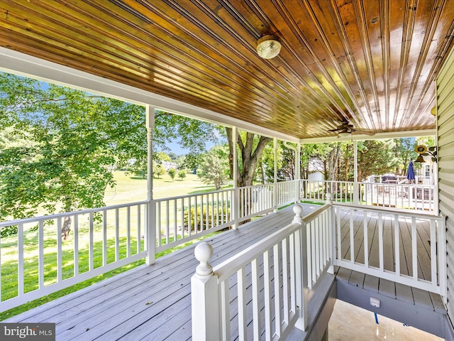 23732 Rolling Fork Way, Gaithersburg, MD 20882 - wooden porch with ceiling fan and view of wooded area