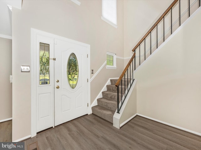23732 Rolling Fork Way, Gaithersburg, MD 20882 - entryway with wood finished floors, stairs, and a high ceiling