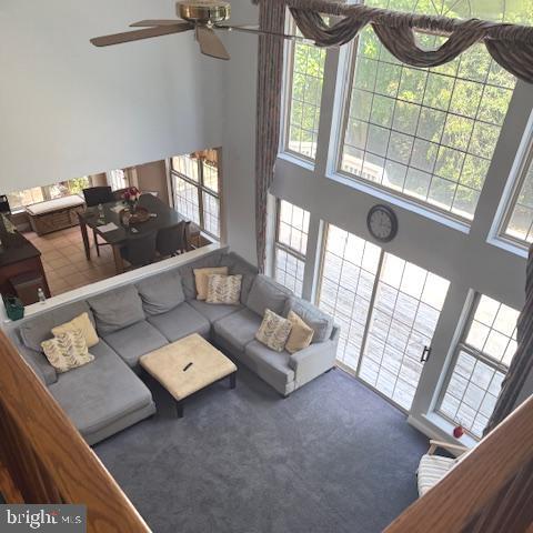 325 Newton Ct, Haddon Township, NJ 08107 - carpeted living room featuring a high ceiling and a ceiling fan