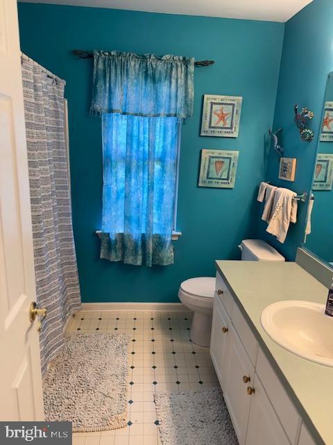 325 Newton Ct, Haddon Township, NJ 08107 - bathroom with vanity, a shower with curtain, and tile patterned floors