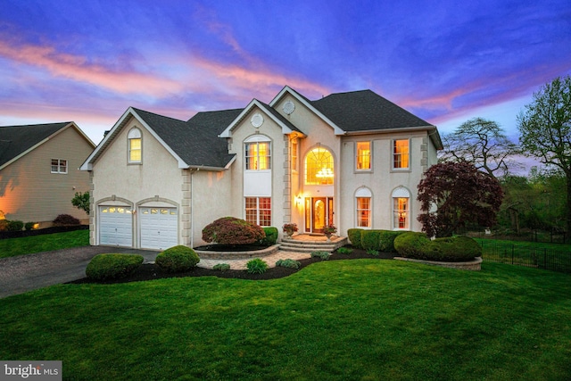 61 Brooks Rd, Moorestown, NJ 08057 - view of front of home with stucco siding, driveway, a garage, and roof with shingles