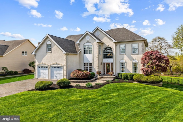 61 Brooks Rd, Moorestown, NJ 08057 - view of front of home with driveway, a garage, stucco siding, and roof with shingles