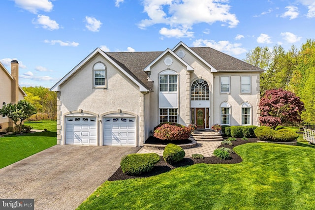 61 Brooks Rd, Moorestown, NJ 08057 - view of front facade featuring driveway, a front lawn, an attached garage, roof with shingles, and stucco siding