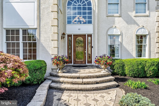 61 Brooks Rd, Moorestown, NJ 08057 - doorway to property featuring stucco siding