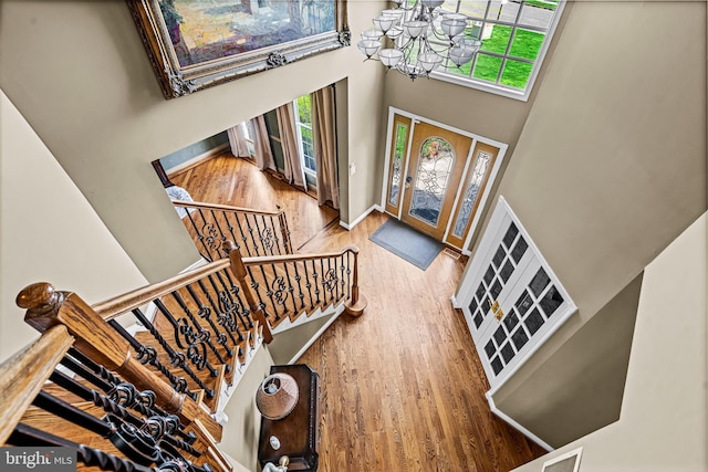 61 Brooks Rd, Moorestown, NJ 08057 - entrance foyer with a high ceiling, a chandelier, wood finished floors, and stairs