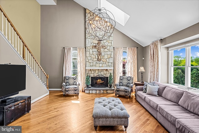 61 Brooks Rd, Moorestown, NJ 08057 - living room with a chandelier, high vaulted ceiling, healthy amount of natural light, wood finished floors, and stairs