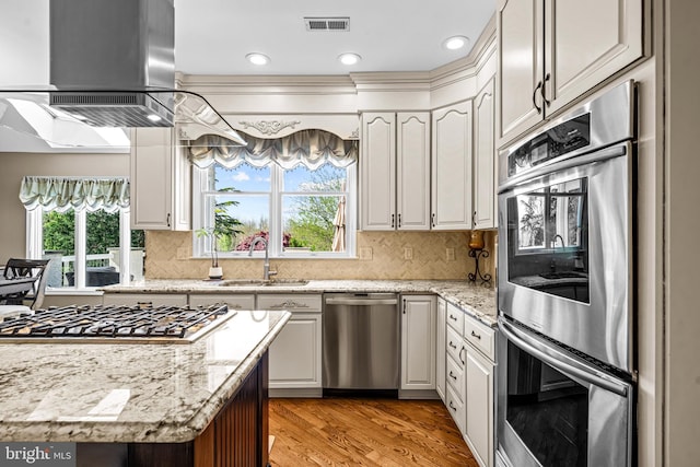 61 Brooks Rd, Moorestown, NJ 08057 - kitchen featuring stainless steel appliances, premium range hood, plenty of natural light, light wood-style flooring, and recessed lighting