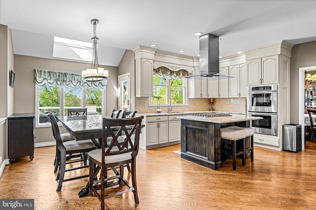61 Brooks Rd, Moorestown, NJ 08057 - kitchen featuring stainless steel appliances, island exhaust hood, backsplash, a center island, and a chandelier