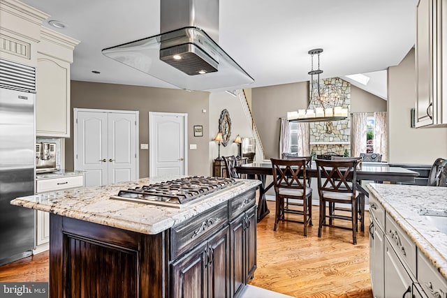 61 Brooks Rd, Moorestown, NJ 08057 - kitchen featuring stainless steel appliances, range hood, light wood finished floors, and dark brown cabinets