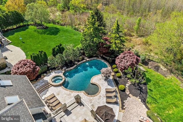 61 Brooks Rd, Moorestown, NJ 08057 - view of swimming pool with a pool with connected hot tub, a patio area, a fire pit, and a yard