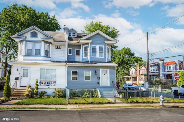 100 Powelton Ave, Lansdowne, PA 19050 - multi unit property with a fenced front yard and a chimney
