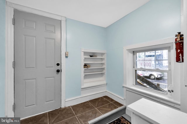 100 Powelton Ave, Lansdowne, PA 19050 - foyer entrance with baseboards and dark tile patterned floors