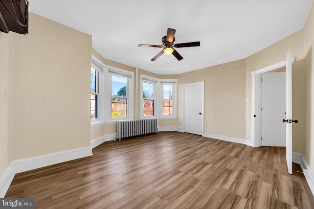 100 Powelton Ave, Lansdowne, PA 19050 - unfurnished bedroom featuring radiator heating unit, wood finished floors, and ceiling fan