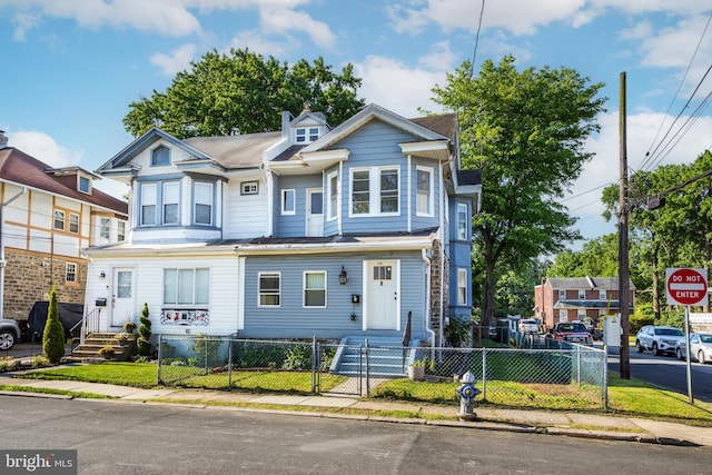 100 Powelton Ave, Lansdowne, PA 19050 - townhome / multi-family property with a fenced front yard and a gate