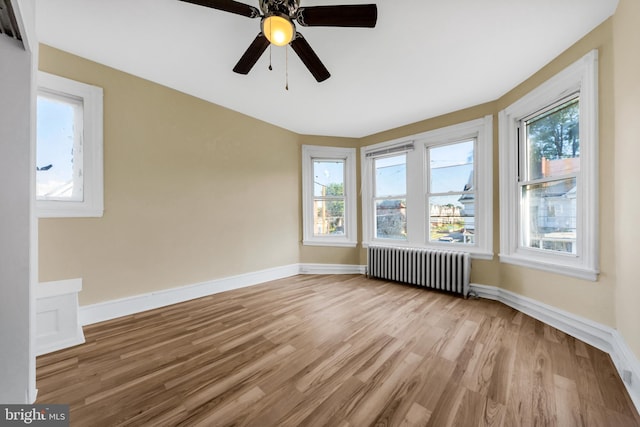 100 Powelton Ave, Lansdowne, PA 19050 - unfurnished room with radiator, wood finished floors, and healthy amount of natural light