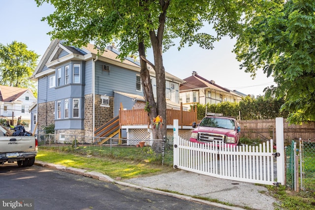 100 Powelton Ave, Lansdowne, PA 19050 - view of front of property featuring stone siding and a fenced front yard