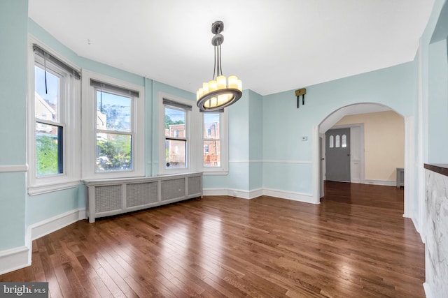 100 Powelton Ave, Lansdowne, PA 19050 - unfurnished dining area with radiator, hardwood / wood-style flooring, arched walkways, and a chandelier