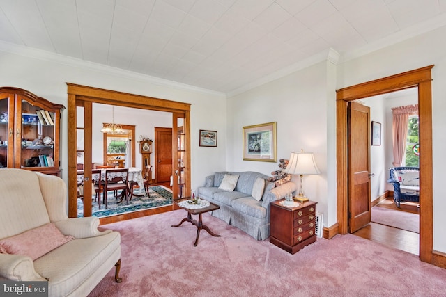 615 Convent Rd, Aston, PA 19014 - living room featuring ornamental molding, a chandelier, and carpet floors